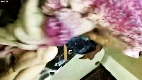 Blurry close-up of Indian wife in pink fluffy lingerie