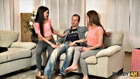 Two slim Asian teens in pink tops tease mom's older boyfriend