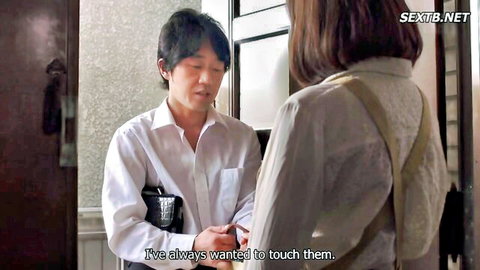Japanese man reaches hands toward clothed housewife's shoulders in sensual teasing moment