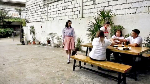 Filipino women in skirts at outdoor table with man in Vivamax hot movie