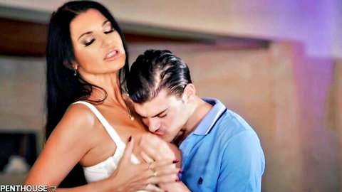 Ania Kinski hot milf embracing young stud in steamy kiss