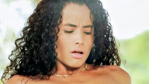Topless curly-haired Latina brunette moaning in ecstasy outdoors