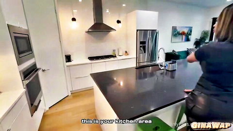 Brunette in tight black outfit bending over kitchen counter from behind