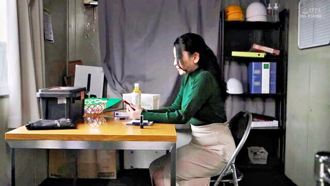Japanese AV idol Isumi Rion in green sweater and beige skirt at desk