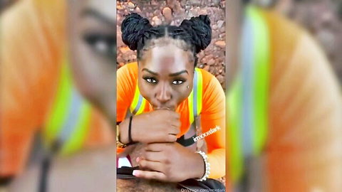 Ebony beauty in hi-vis vest pouting seductively at construction site