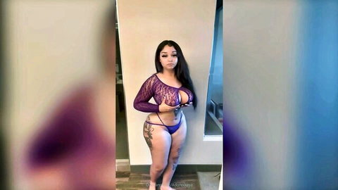 Curvy ebony woman posing in sheer purple lingerie, big tits and ass