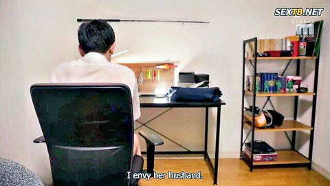 Clothed Asian man sits at home office desk with fishing gear as viewer envies his slutty wife