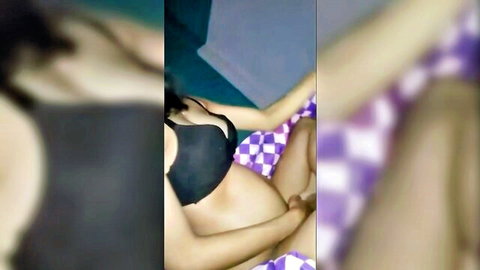 Pregnant Asian woman in black bra and checkered panties, teasing intimately