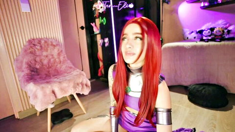 Petite Starfire cosplay babe in tight purple bodysuit spreads legs teasing on webcam