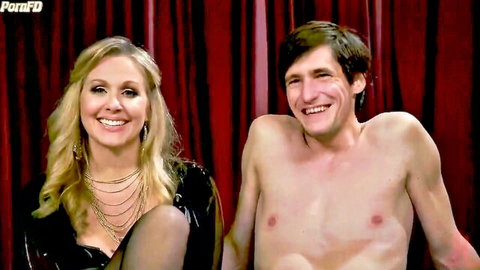 Blonde MILF mistress in black dress with smiling nude man
