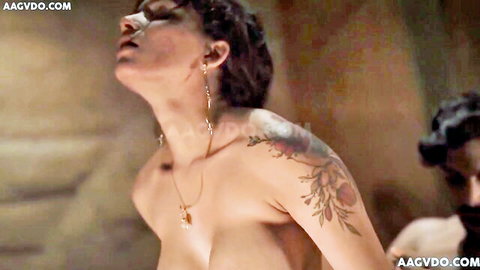 Resmi R Nair topless ecstasy pose with shoulder tattoos in hardcore OnlyFans scene