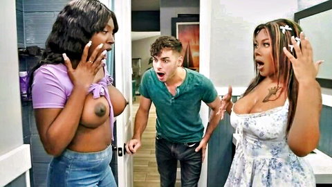 Shocked ebony babe with huge bare tits exposed and busty Asian woman surprised by guy in bathroom threesome