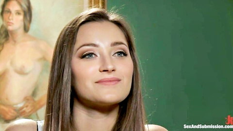 Dani Daniels seductive smile and cleavage in Yes Sir BDSM tease