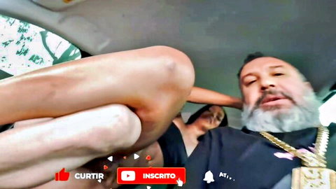 Manuela Goncalves trans legs spread in car with bearded man