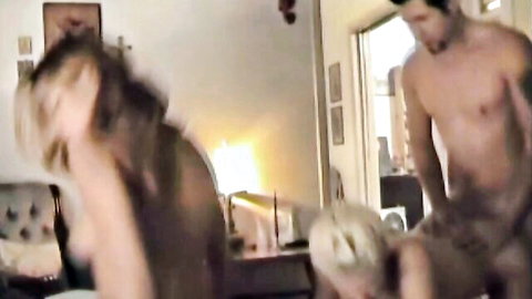 Blurry Greek amateur foursome scene with tattooed man and long-haired woman in doggy style