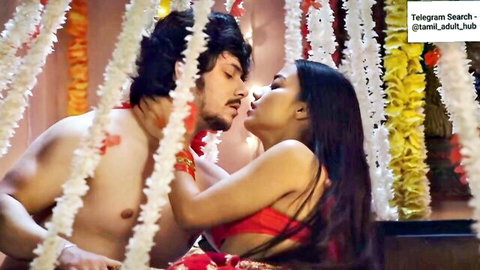 Tamil couple in red saree and shirtless embrace, intimate moment from Maa Devarani Beti Jethani E1