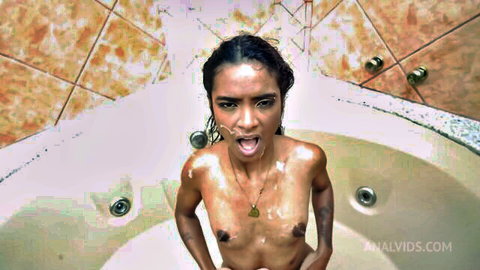 Jasmine Santanna wet and nude in bathtub, mouth open seductively