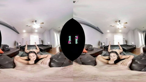 Tanned brunette lounging nude on couch in seductive VR pose