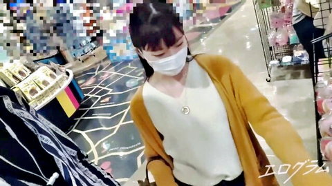 POV amateur Japanese girl in mask and orange cardigan walking through colorful toy store shelves