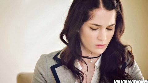 Evelyn Claire as horny college girl in blazer and choker, seductive gaze
