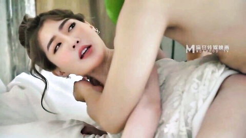 Closeup of sexy Asian woman with bare tits and ecstatic O-face during steamy sex