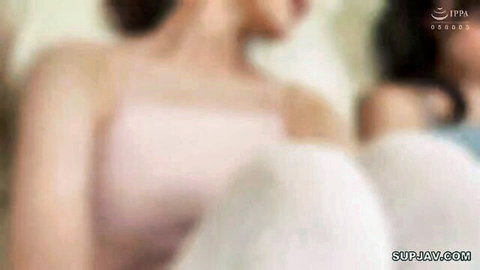Blurry JAV thumbnail of Asian woman in pink bra exposing side boob, white bottoms, intimate pose