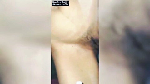 Blurry close-up of woman's pale arm with hair in hijab adult video