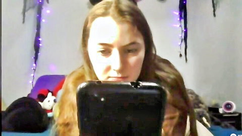 Snowbunnycake teen girl with long brown hair in amateur webcam closeup