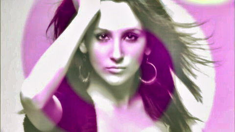 Samantha in purple top, intense gaze, hoop earrings, commanding pose