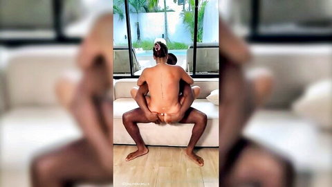 Brunette white girl rides muscular black man's cock reverse cowgirl on couch