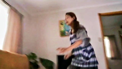 Hot Japanese MILF in sexy plaid dress and apron, posing playfully
