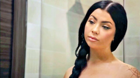 Seductive topless Latina with black braided hair in bathroom tease
