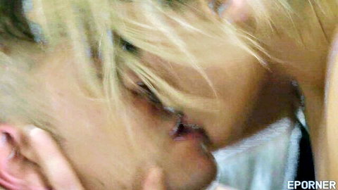 Brittany Bardot and Juan Lucho in intense close-up kiss