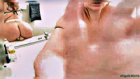 Curvy redhead camgirl Abigail Morris bends over in bathtub showing huge wet ass and pussy