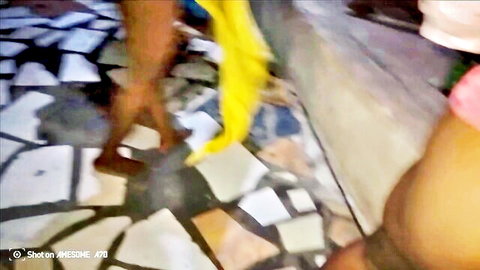 Ebony woman spreads legs flashing pink panties with yellow boa on tiled floor
