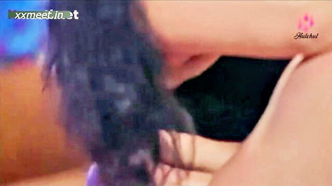 Dark-haired Indian babe teases cock bulge with tattooed arm in closeup handjob