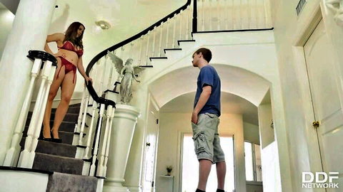 Brunette MILF in red lingerie teases young guy on grand staircase