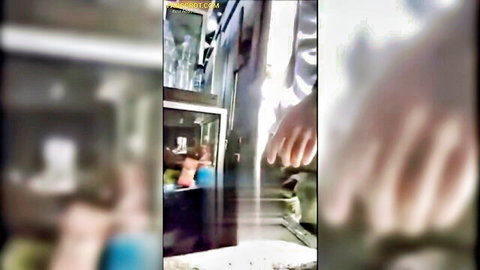 Blurry homemade Indonesian couple in steamy shower, nude Asian wife behind glass with husband's hands pressed on it