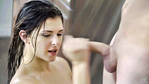 Wet skinny brunette teen grips thick hard cock close to her lips in shower