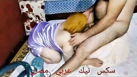 Blonde Arab woman in purple satin lingerie sucking thick erect cock on bed