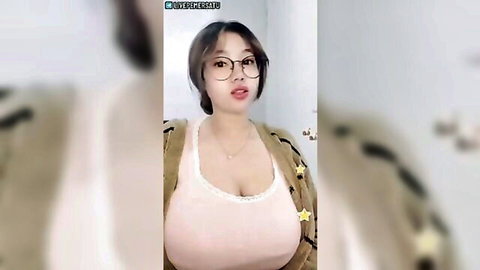 Indonesian beauty with glasses and busty cleavage in pink tank top