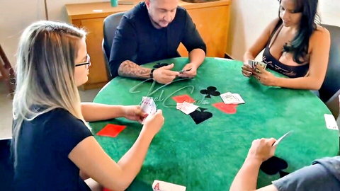 Sexy brunette and blonde amateurs with deep cleavage play poker with studs at green table