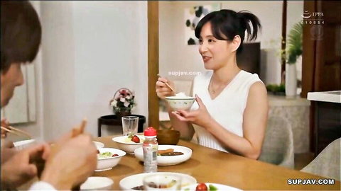 Japanese MILF in tight white tank top eats rice seductively at dinner with man