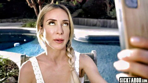 Blonde babe in sheer lace top takes poolside selfie teasing her perky tits