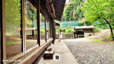 Ema Futaba in elegant white dress, teasing outdoors at Japanese shrine