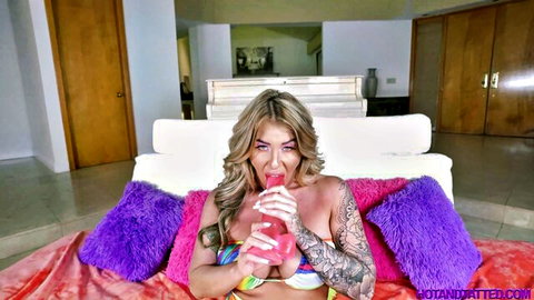 Lolly Dames in pink bikini sucking pink dildo, hot tatted blonde