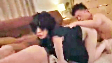 Asian couple in doggy style sex, woman in black dress, man behind on couch