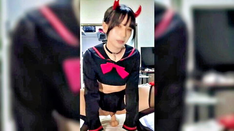 Asian shemale in sexy sailor uniform with devil horns posing on all fours