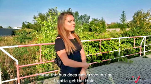 Sexy teen Mila waiting at bus stop in black top and skirt