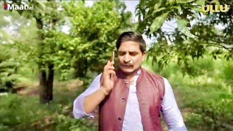 Desi Indian man in maroon vest and white kurta talking on phone outdoors in green field, Aah Se Aaha Tak Ep 4
